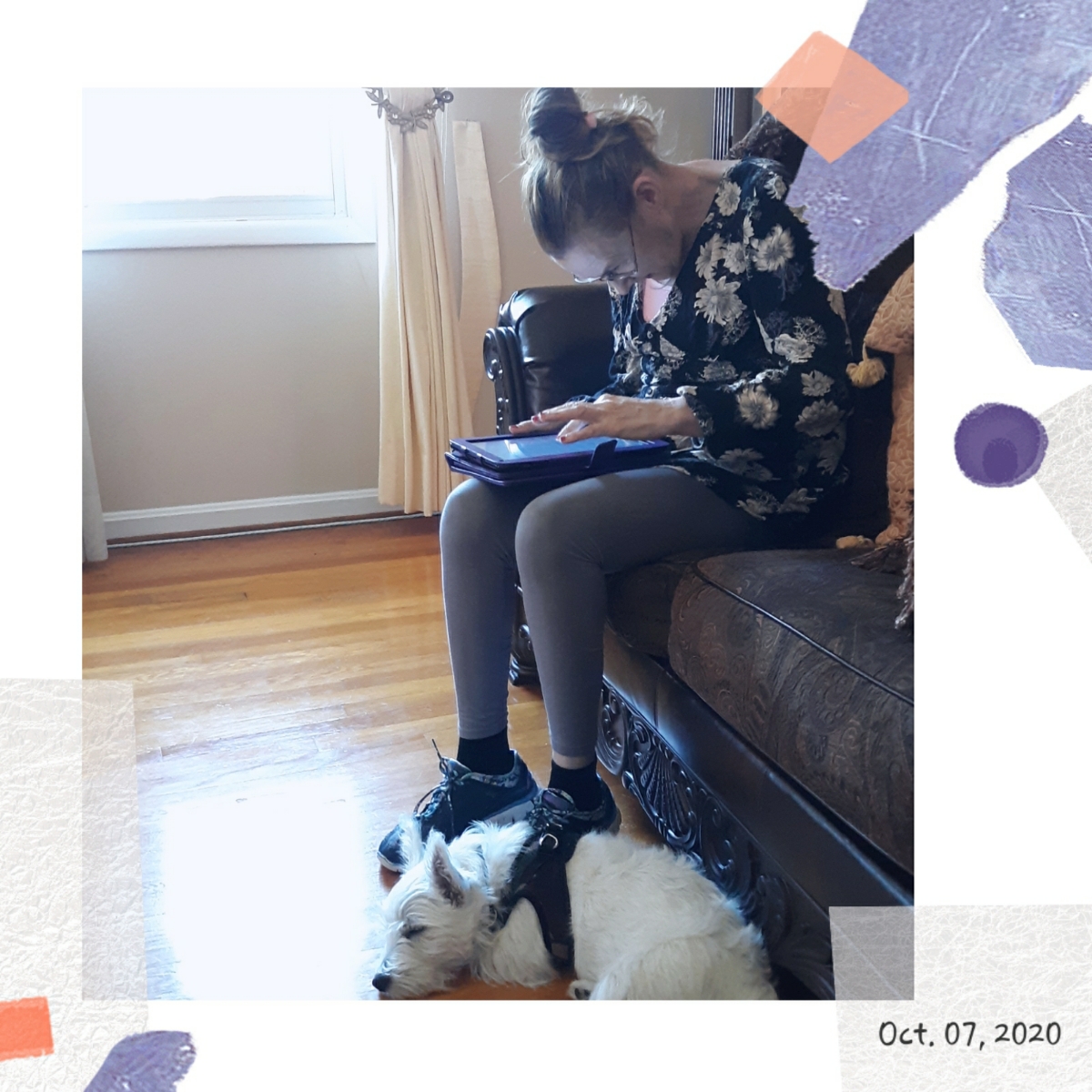 Lisa sitting on a couch using a tablet with a small dog resting on their lap, dated October 7, 2020.